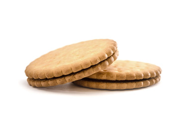 Two cracker cookies isolated on a white background. Close-up. Side view. Sandwich Cookies.