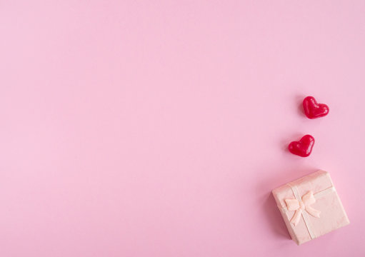 Valentines Day Flat Lay With Two Red Hearts And Present Box On Pink Background. Top View, Copy Space.