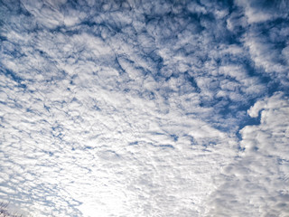 Many white clouds on blue sky background