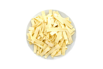 Italian pasta in a white plate isolated on a white background. View from above. Pasta with durum wheat.