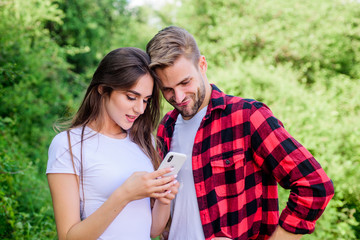 communication concept. couple in love. Blogging concept. navigator search. romantic date online. man pry phone of girl. Jealousy. personal space concept. Got lost. couple use smartphone outdoor