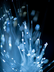 Abstract blur light sparkler. Optical fiber network cable on black background.