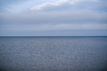 Obraz premium empty sea beach in autumn with some bushes and dry grass