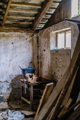 old abandoned house interior with broken furniture and empty windows