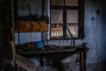 Fototapeta na wymiar old abandoned house interior with broken furniture and empty windows
