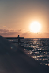 Fototapeta premium person gazing sunset