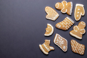 Christmas background. Handmade festive gingerbread cookies. Copy space for text. Winter holidays background mock up