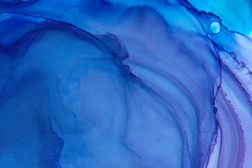 Blue and purple watercolor texture background. Hand drawn blue smears, splashes abstract texture, alcohol ink.