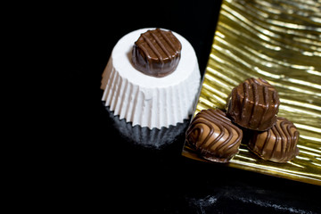 Various of sweet confectionery with chocolate candies and pralines. Handmade chocolates. Realistic chocolate set, delicious dessert pattern.