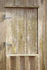 Weathered wood window in the sunshine