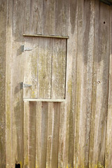 Weathered wood window in the sunshine