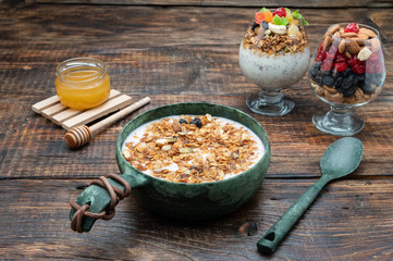 Granola with yogurt and chia seeds. Granola and chia pudding. Breakfast with granola.