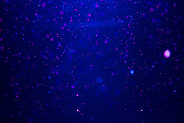 Bubbles under water. Abstract blurred background, dark blue color