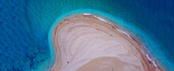 Aerial drone ultra wide top down photo of tropical exotic island bay with turquoise sea