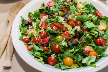 Fresh organic vegetable mixed salad closeup as food background