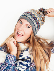 young pretty blond woman in hat and winter scarf smiling cheerful on white background, lifestyle people concept
