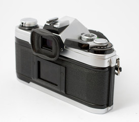 Classic analog single-lens reflex camera isolated on white background