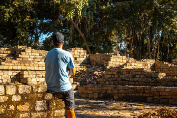 A young man enjoying the temples of Copan Ruinas. Honduras