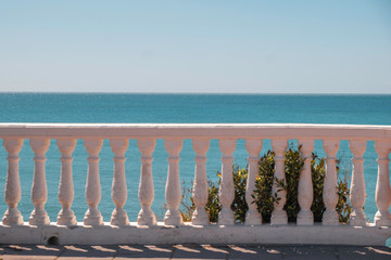 white stairs railings on blue sea background in Spain, copy space
