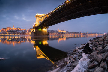 Naklejka na ściany i meble Ice flowing on river Danube at night