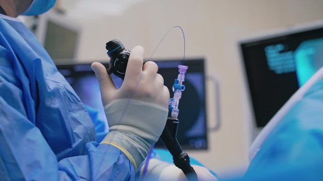 Close up shot of medical team performing surgical operation in modern operating room