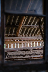 old abandoned house interior with broken furniture and empty windows