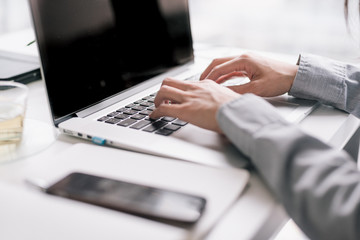 Working on laptop at table