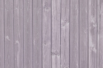 Wooden fence made of light brown painted boards. Tinted photo. Background for sites and layouts.
