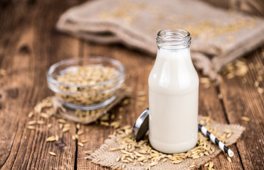 Portion of fresh Oat Milk (selective focus; close-up shot)