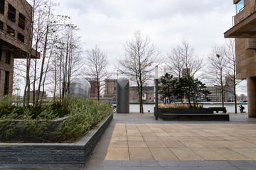 view between buildings and plants of port of rotterdam
