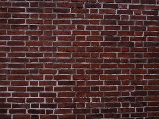 Old european red brick wall, abstract vintage grunge background texture.