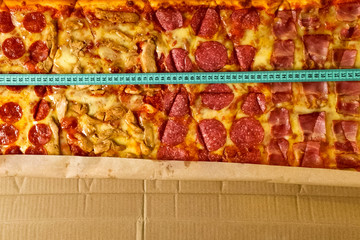 Measure pizza length with a tape measure