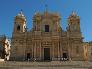 Fototapeta na wymiar Noto – Cathedral of San Nicolò facade in baroque style with two towers, columns, dome and staircase