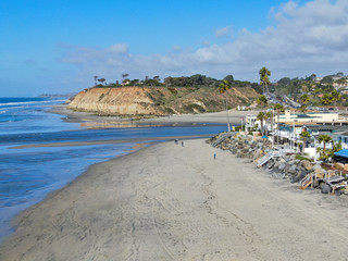 Aerial view of Del Mar North Beach, California coastal cliffs and House with blue Pacific ocean....
