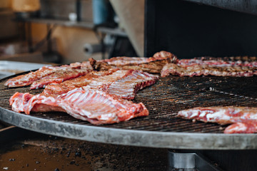 Grilled pork ribs on the grill at street food festival