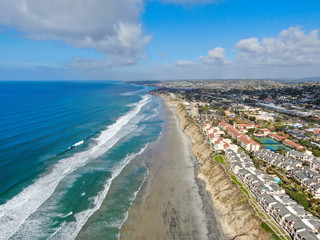 Aerial view of Del Mar North Beach, California coastal cliffs and House with blue Pacific ocean....