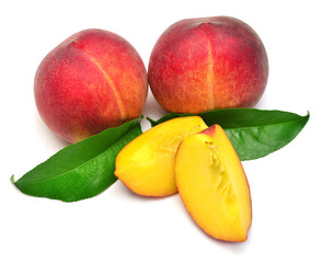 Peach fruit whole and slice with leaf isolated on white background. Perfectly retouched, full depth of field on the photo. Flat lay, top view