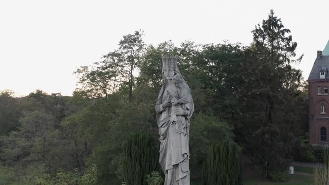 Religious statue in the woods leuven flanders belgium aerial