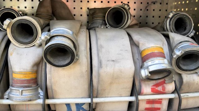 Rolls of the firehose on the side of the firetruck