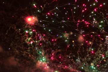 Obraz na płótnie Canvas explosion of multicolored fireworks flash in the sky