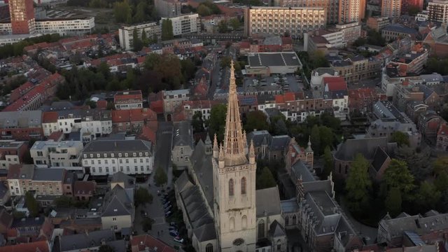 Cinematic sunset drone view of church of the historic city of  downtown Leuven