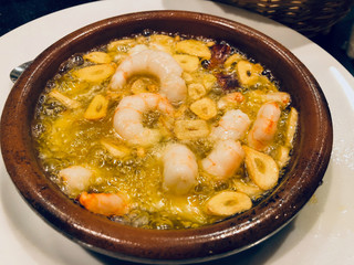 Grilled shrimps in olive and garlic served in ramkin dish