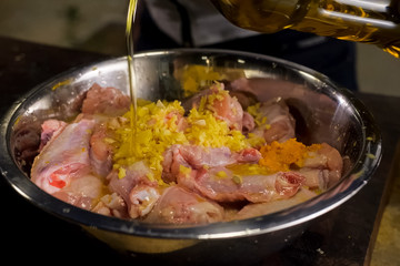 pour chicken meat with sunflower oil. meat