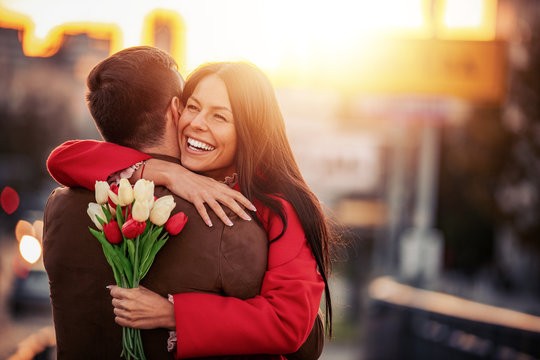 Romantic Man Giving Flowers To His Girlfriend