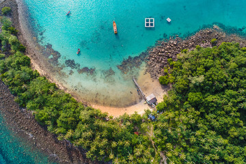 Tropical island sea with green palm forest curve white sand beach