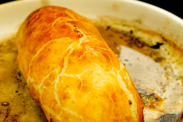 a Prepared meatloaf with dough roll cutting meatloaf.