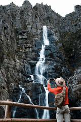 tourist man en route along a path seeing the natural landscape