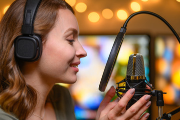 Reading a radio host or blogger text in a home studio into a microphone, radio or broadcast. Working with sound