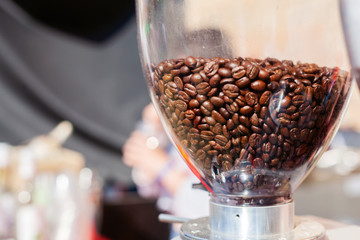 Fresh coffee beans in a grinder