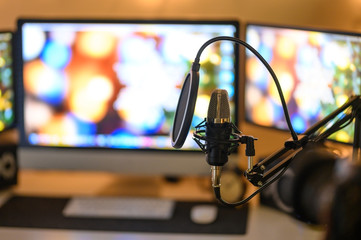 Microphone on home studio background. Blogging and radio.